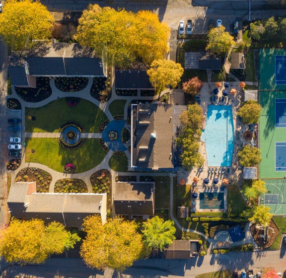 a birds eye view of a tennis court with trees and a pool at Indian Creek Apartments, Cincinnati, OH, 45236