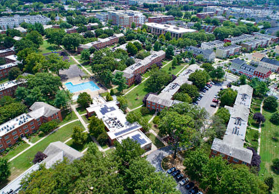 an aerial view of a city with buildings and trees