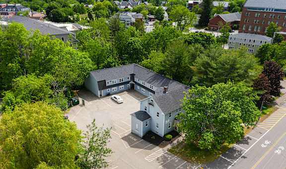 arial view of a large gray building with a gray roof