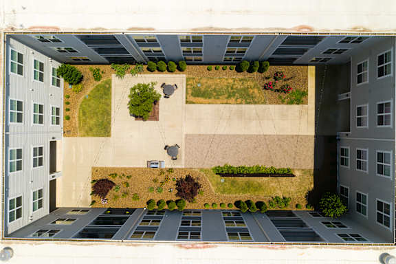 an aerial view of a parking lot in front of a building at Watermark at Steele Crossing, Arkansas
