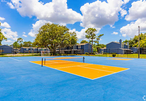 the tennis court at the estates apartments