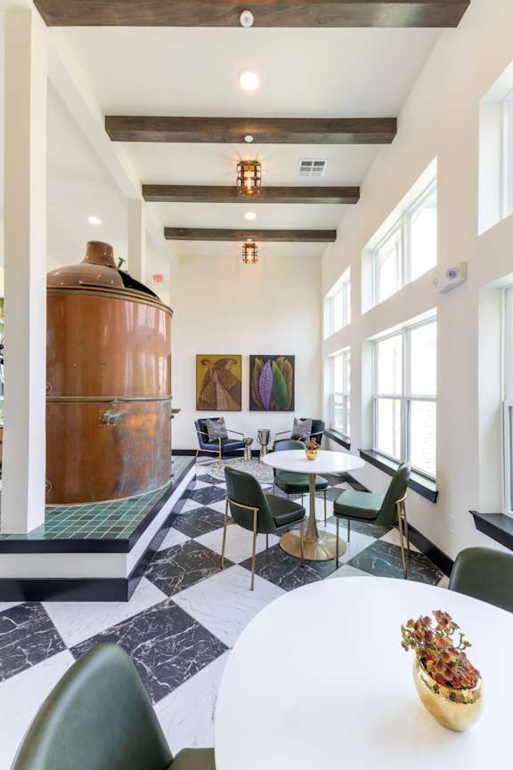 A reception area with a piano and chairs.