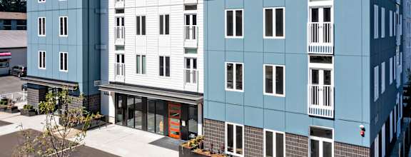 a view of the front of the building from the parking lot at The Hub, Lacey, WA, 98503