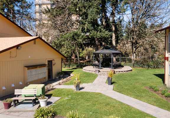 A small building with a gazebo in front of it.