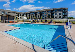 our apartments have a resort style pool with lounge chairs