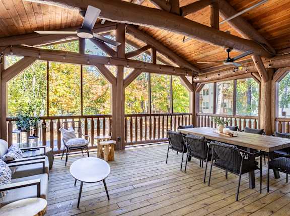 Apartments in Maple Grove, MN - Birchwood Apartments - Porch with Outdoor Ceiling Fans and Patio Furniture