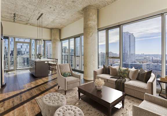 A living room with a view of the city.
