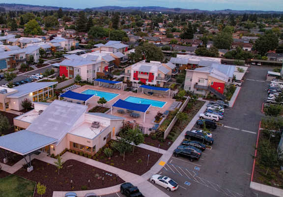 an aerial view of a building with a large solar panel on the roof at Addison Ranch Apartments, Petaluma, CA