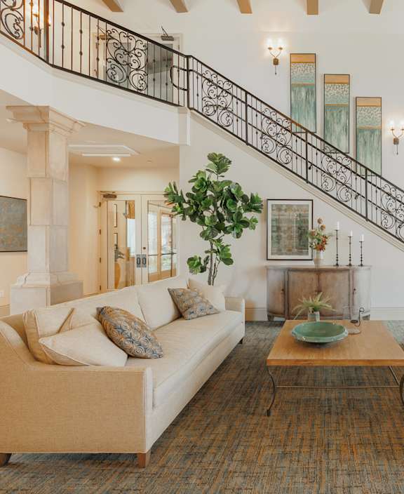 A Living Room with a Staircase at The Villas at Ellis Manor, Fresno, 93720
