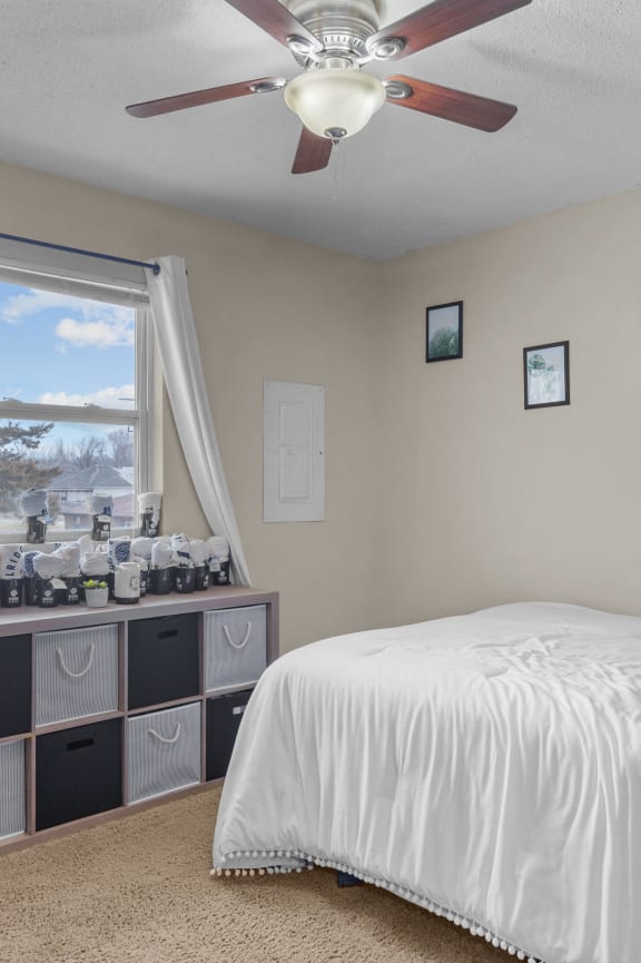 a bedroom with a bed and a christmas tree
