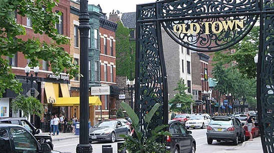a city street with a sign for old town