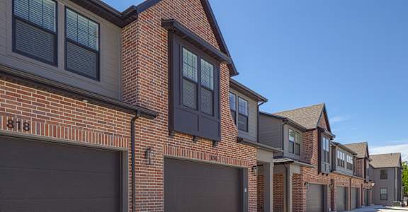 A row of houses with garages and number 818 on the front.