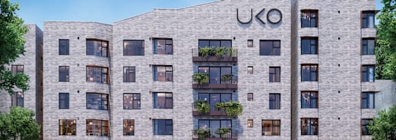 A modern building with the letters U.K.O on the side.