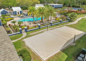 Thumbnail 12 of 13 - a backyard with a swimming pool and palm trees