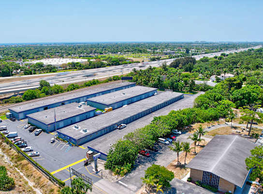 an aerial view of a factory with an empty parking lot