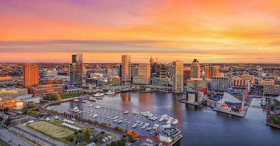 a sunset over the baltimore inner harbor