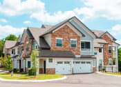 Thumbnail 23 of 24 - exterior building shot with attached garages at Creekside at Providence, Mt Juliet