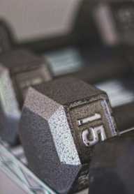 A close up of a dumbbell with the number 15 on it.