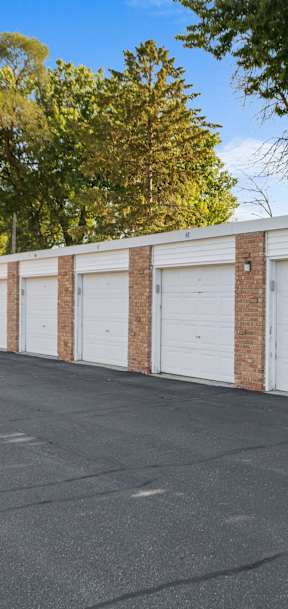 A long row of garage doors are closed.