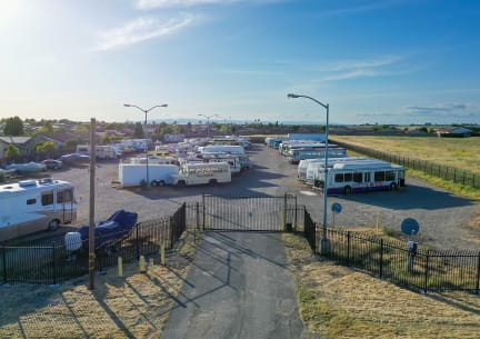 a group of buses parked in a parking lot