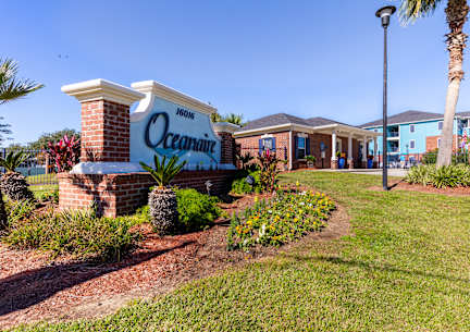 A sign that says Oceanaire in front of a building.