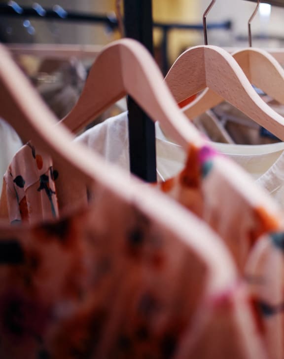 a rack of clothes in a clothing store