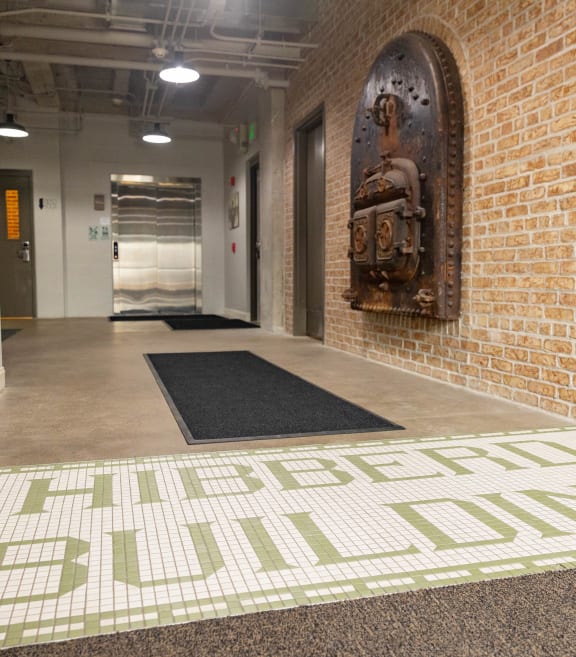 a brick wall with a mural and a carpet with the words affordable ball dodgers
