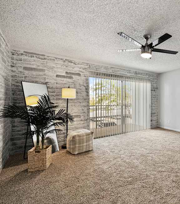 an empty living room with a ceiling fan and a window