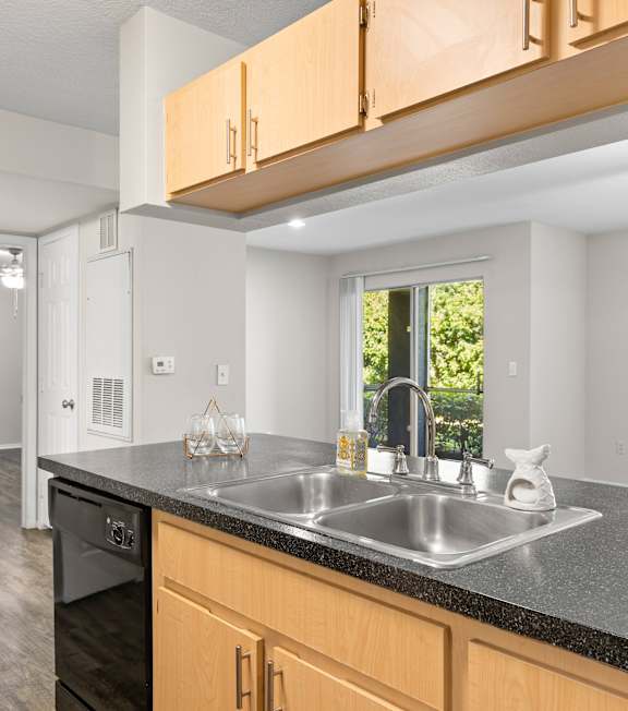 A kitchen with a sign that says "our nest".
