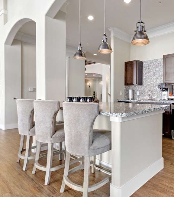 resident kitchen with chairs at bar height counter