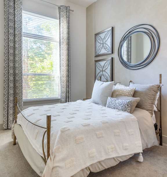 an example of a bedroom with a bed and a window