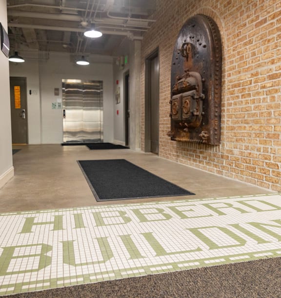 a brick wall with a mural and a carpet with the words affordable ball dodgers
