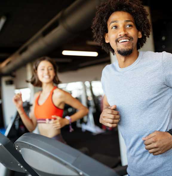 Man and woman exercising on treadmill at Artisan, O’Fallon, Illinois