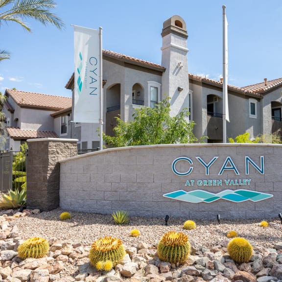 the cyan at green valley sign in front of a building
