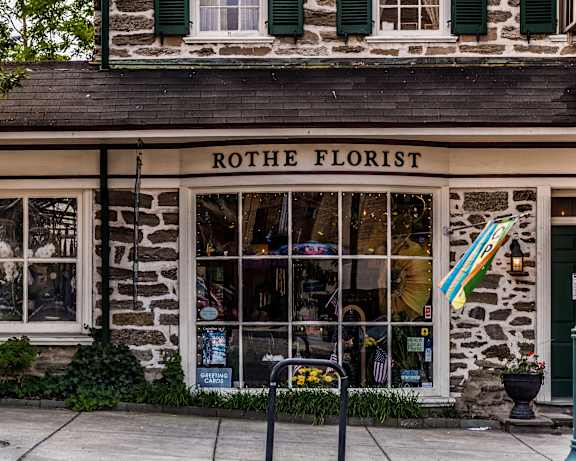 A flower shop named Rothe Florist is open for business.