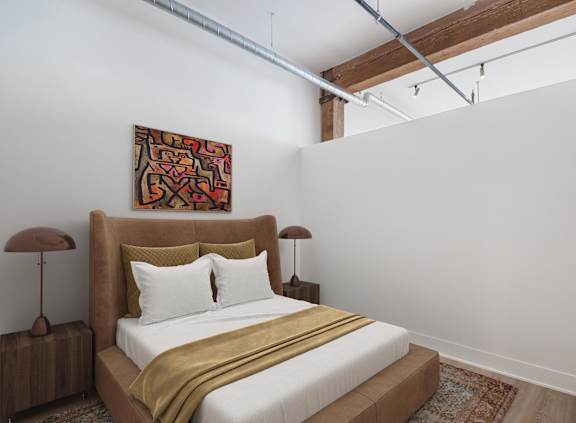 A bedroom with a large bed and a painting on the wall.