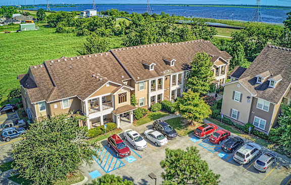 A large building with a parking lot in front of it.
