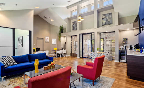 a living room filled with furniture and a large window