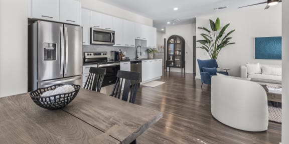 a rendering of a communal area in the clubhouse at the flats at big tex apartments in san