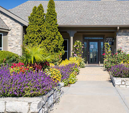 A welcoming clubhouse with a classic brick exterior and well-kept landscaping.