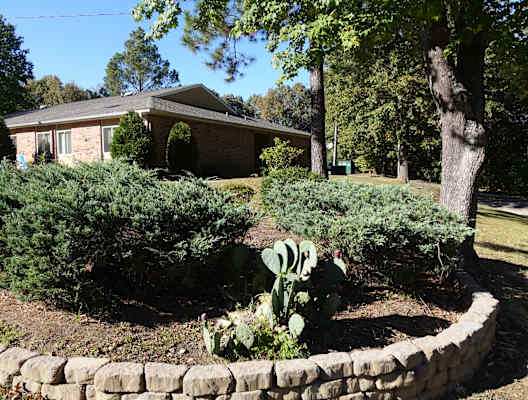 a retaining wall in front of a house