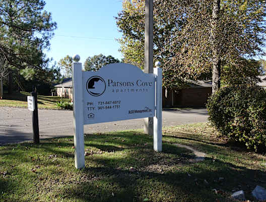 a sign in front of a house