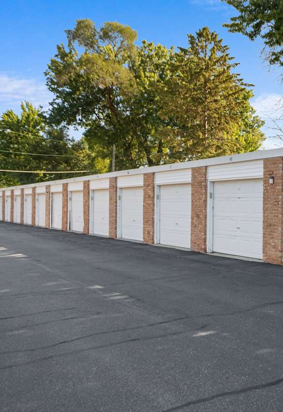A long row of garage doors are closed.