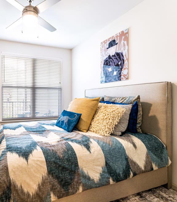 a bedroom with a bed and a ceiling fan at The Parker Austin, Pflugerville, 78660