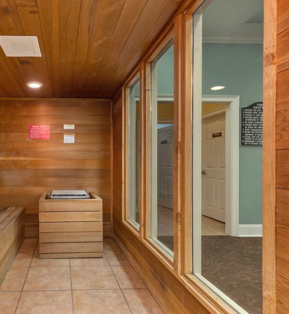 a sauna with wooden walls and a window at Bedford Parke Apartments in Warner Robins, Georgia