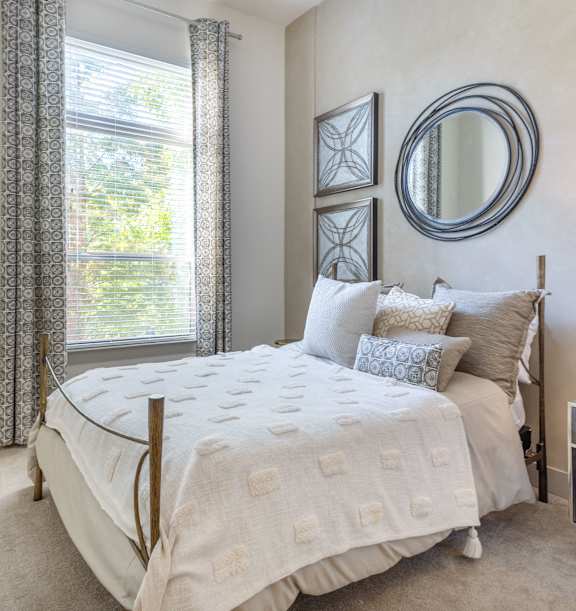 Cozy Marietta, GA apartment bedroom with carpeting and modern finsihes.