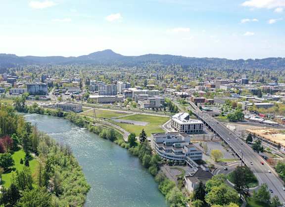 an aerial view of the city with a river