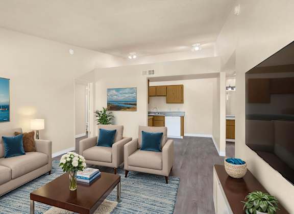 A living room with a couch, chairs, a coffee table, and a painting on the wall.