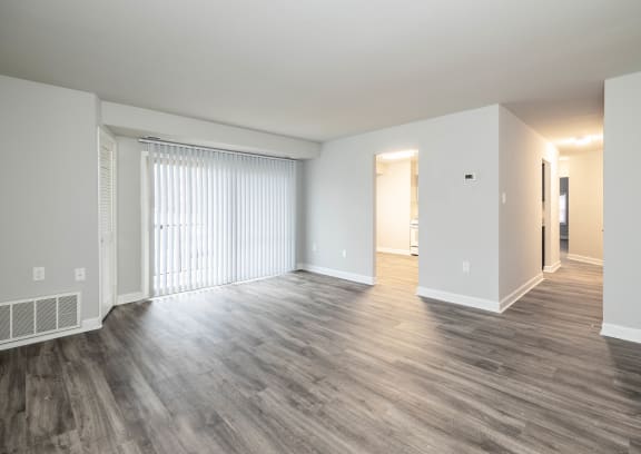 a bedroom with hardwood flooring at the oxford at estonia apartments in san an
