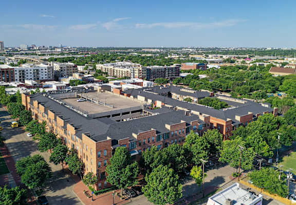 an aerial view of a city with buildings and trees